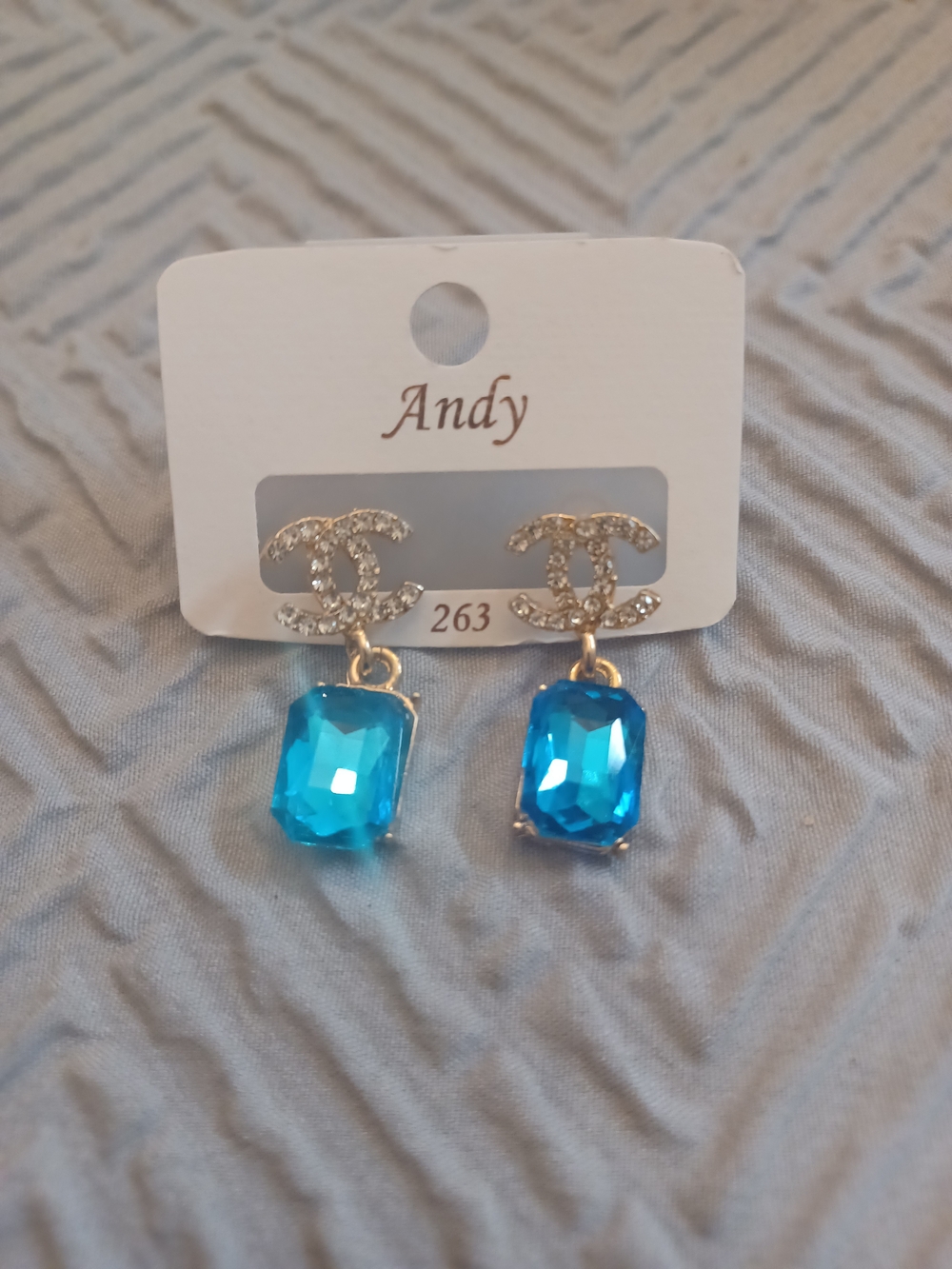 Blue Crystal Drop Earrings with Rhinestone Logo Accent